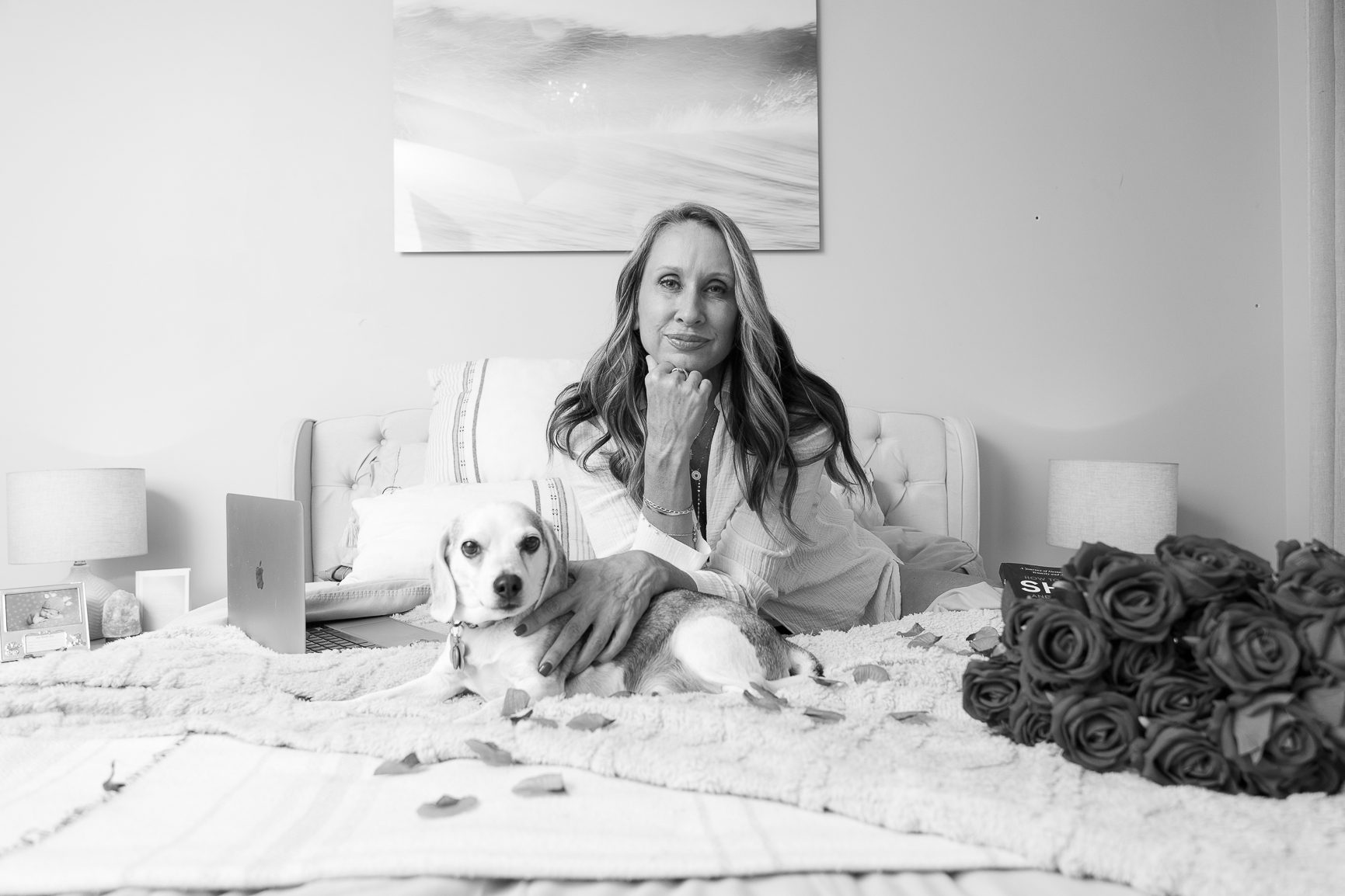 Kelly O’Shea at home with her beagle Bailey, in black and white